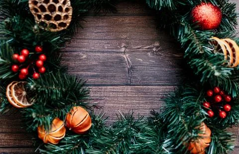 Christmas background pine tree with dried tangerines wooden background. The Stock Photos