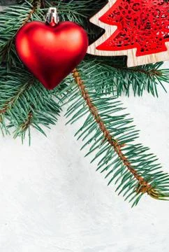 Christmas background red, border, branches of a Christmas tree, heart, pine c Stock Photos