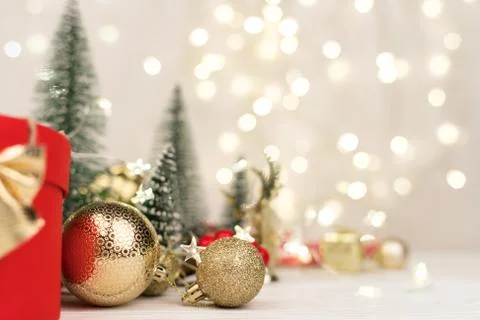 Christmas background , red gift box with a Golden bow on the background of Ch Stock Photos