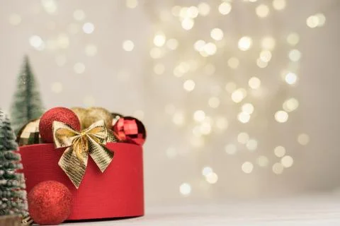 Christmas background , red gift box with a Golden bow on the background of Ch Stock Photos