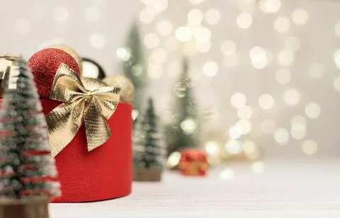 Christmas background , red gift box with a Golden bow on the background of Ch Stock Photos