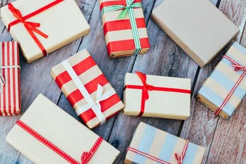 Christmas background with red gift boxes on the wooden board. 库存照片