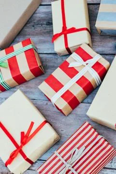 Christmas background with red gift boxes on the wooden board. Stock Photos
