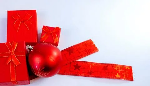 Christmas background with red gift boxes and decorative ribbon Stock Photos