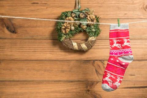 Christmas background with a red sock placed on a rope. Stock Photos