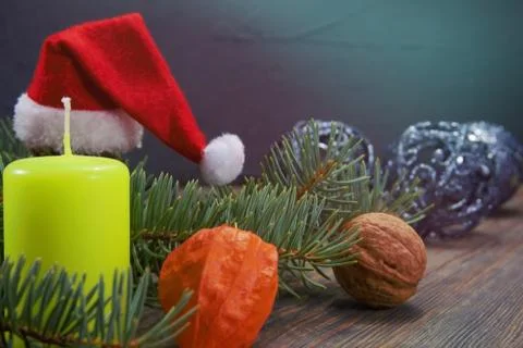 Christmas background with Santa hat and candle Stock Photos