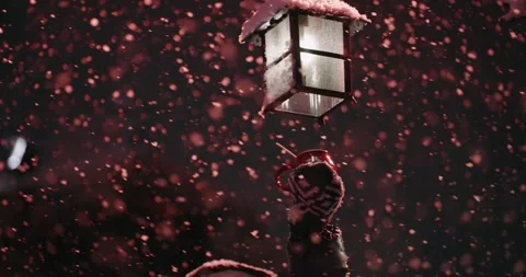 Christmas background with snowfall in slow motion. A person is holding a cup  Video stock 318243384