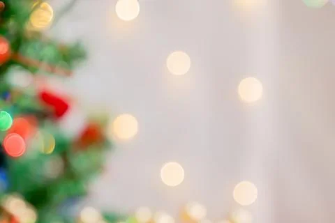 Christmas background with a soft-focus effect, blurred fir branches with ligh Foto stock