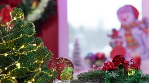 On a Christmas background on a stand with rotating decorations Video stock 257659921