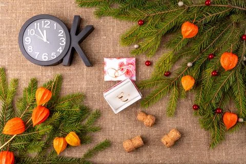 Christmas background with the texture of burlap, tree branches and toys Stock Photos