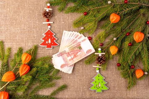 Christmas background with the texture of burlap, tree branches and toys Stock Photos