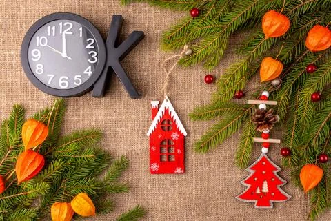 Christmas background with the texture of burlap, tree branches and toys Stock Photos