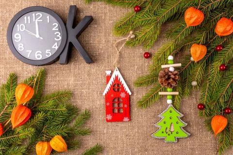 Christmas background with the texture of burlap, tree branches and toys Stock Photos