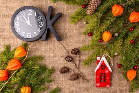 Christmas background with the texture of burlap, tree branches and toys Stock Photos