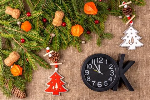 Christmas background with the texture of burlap, tree branches and toys Stock Photos