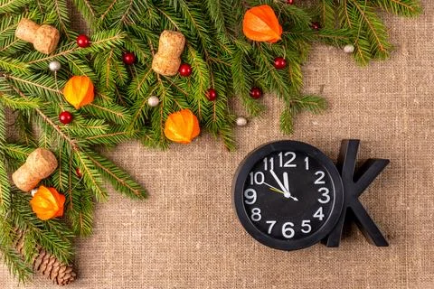 Christmas background with the texture of burlap, tree branches and toys Stock Photos