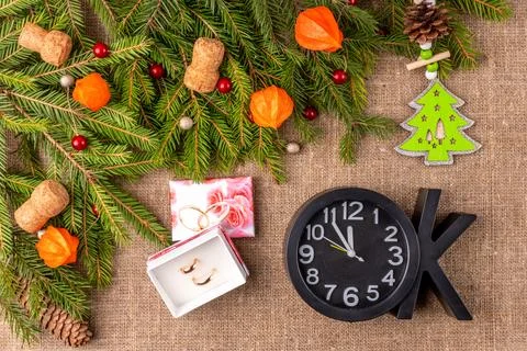 Christmas background with the texture of burlap, tree branches and toys Stock Photos