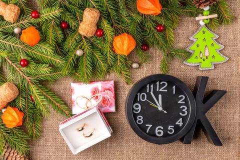 Christmas background with the texture of burlap, tree branches and toys Stock Photos