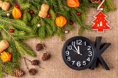 Christmas background with the texture of burlap, tree branches and toys Stock Photos