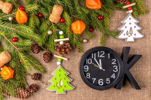 Christmas background with the texture of burlap, tree branches and toys Photos