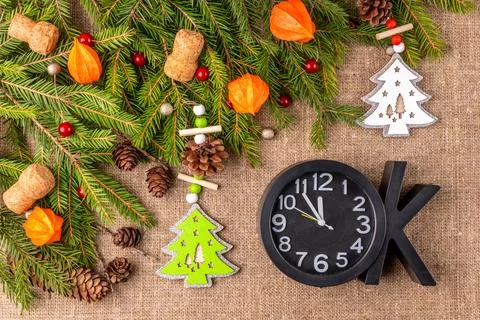 Christmas background with the texture of burlap, tree branches and toys Stock Photos