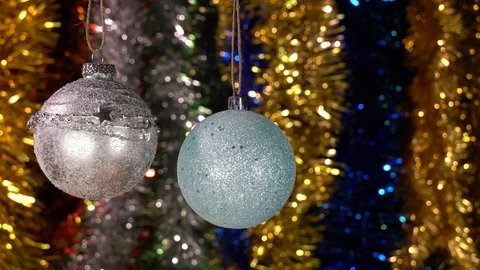 Christmas background with two balls hanging on a Christmas tree Stock Footage 121482863