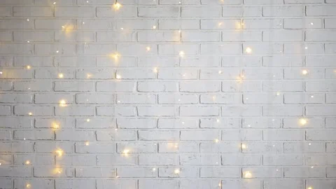 Christmas background - white brick wall with shiny lights Stock Footage 185929294