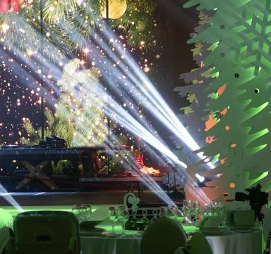 Christmas backgrounds with light rays. Spotlight realistic ray. Stock Photos