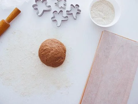 Christmas baking background: dough, cookie cutters and spices. Viewed from above Stock Photos