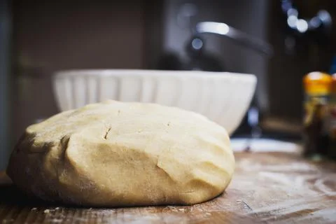 Christmas baking. Making gingerbread biscuits. Cookie dough on the counter. Stock Photos