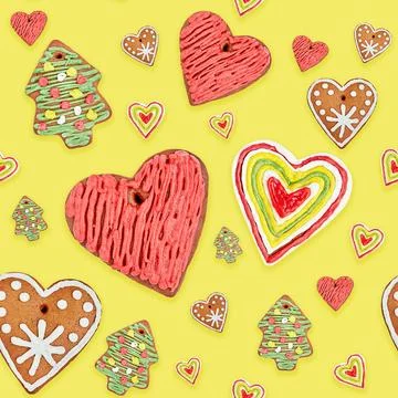 Christmas baking pattern with gingerbread hearts cookies on yellow background Stock-Fotos