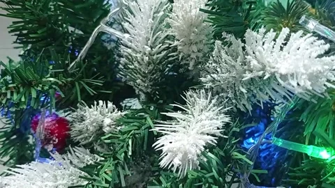Christmas ball on the background of a festive tree, vertical video. Video stock 166141193