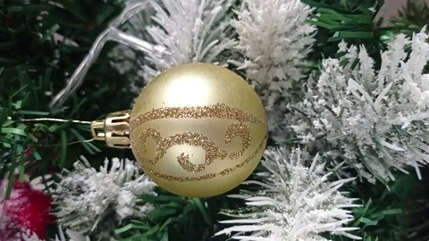 Christmas ball on the background of a festive tree, vertical video. Video stock 166141249