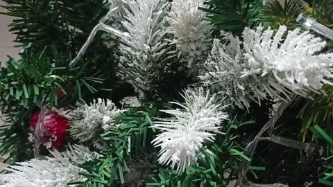 Christmas ball on the background of a festive tree, vertical video. Video stock 166141254