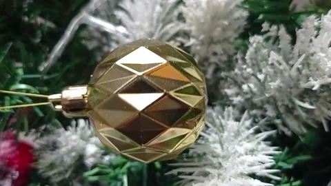 Christmas ball on the background of a festive tree, vertical video. Video stock 166141257