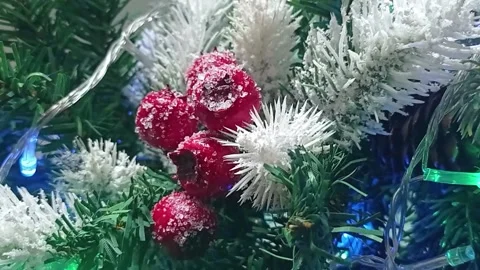 Christmas ball on the background of a festive tree, vertical video. Video stock 166141324