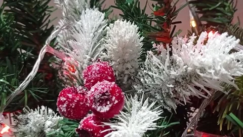 Christmas ball on the background of a festive tree, vertical video. Video stock 166141325