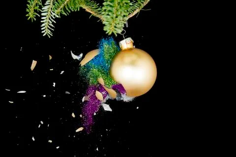 Christmas ball exploding, throwing glitters around Stock Photos