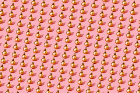 Christmas ball gold pattern on light pink background small ball Stock Photos