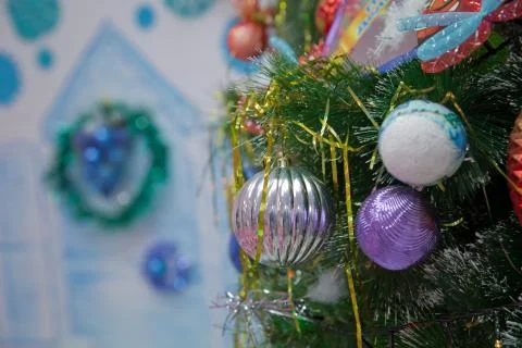 A Christmas ball hangs on the background of a clock. It's time for a new year Stock Photos