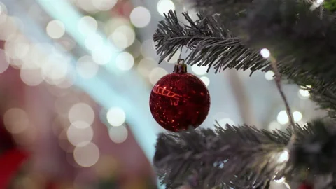 Christmas ball on pine tree branch blurred bokeh night scene merry x mas Stock Footage 166663100