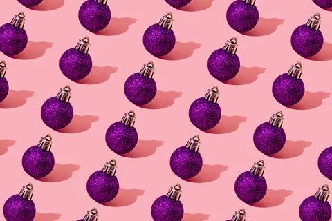 Christmas ball purple pattern on light pink background medium ball Stock Photos