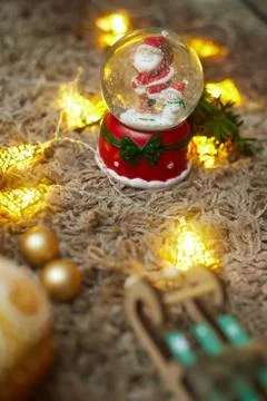 Christmas ball with snow and santa claus and toys, bokeh, flatley, copy space Stock Photos