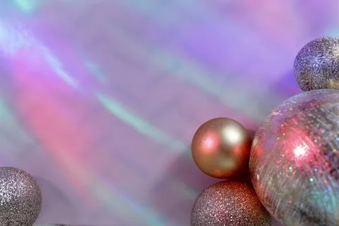 Christmas balls on a background of colored lights and bokeh. Stock Photos