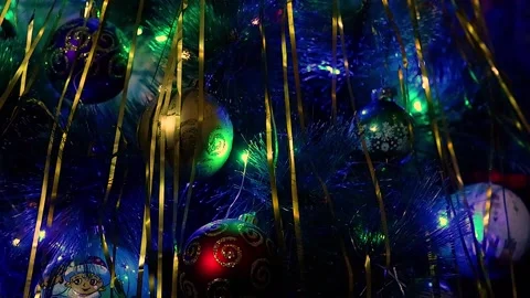 Christmas balls on the Christmas tree with a multi-colored garland Stock Footage 167761429