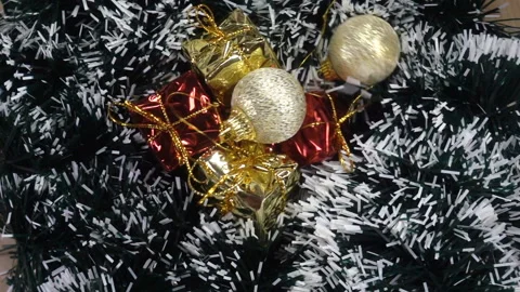 Christmas balls falling in slow motion on artificial branches Stock Footage 143426251