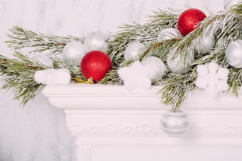 Christmas balls on fireplace Stock Photos