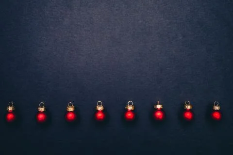 Christmas balls flat layout on dark background. Stock Photos