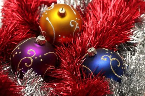 Christmas balls with gold pattern on silver and red tinsel christmas balls... Stock Photos