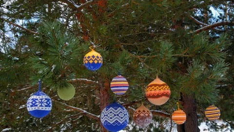 Christmas balls hanging on pine branches covered with snow Stock Footage 70292941